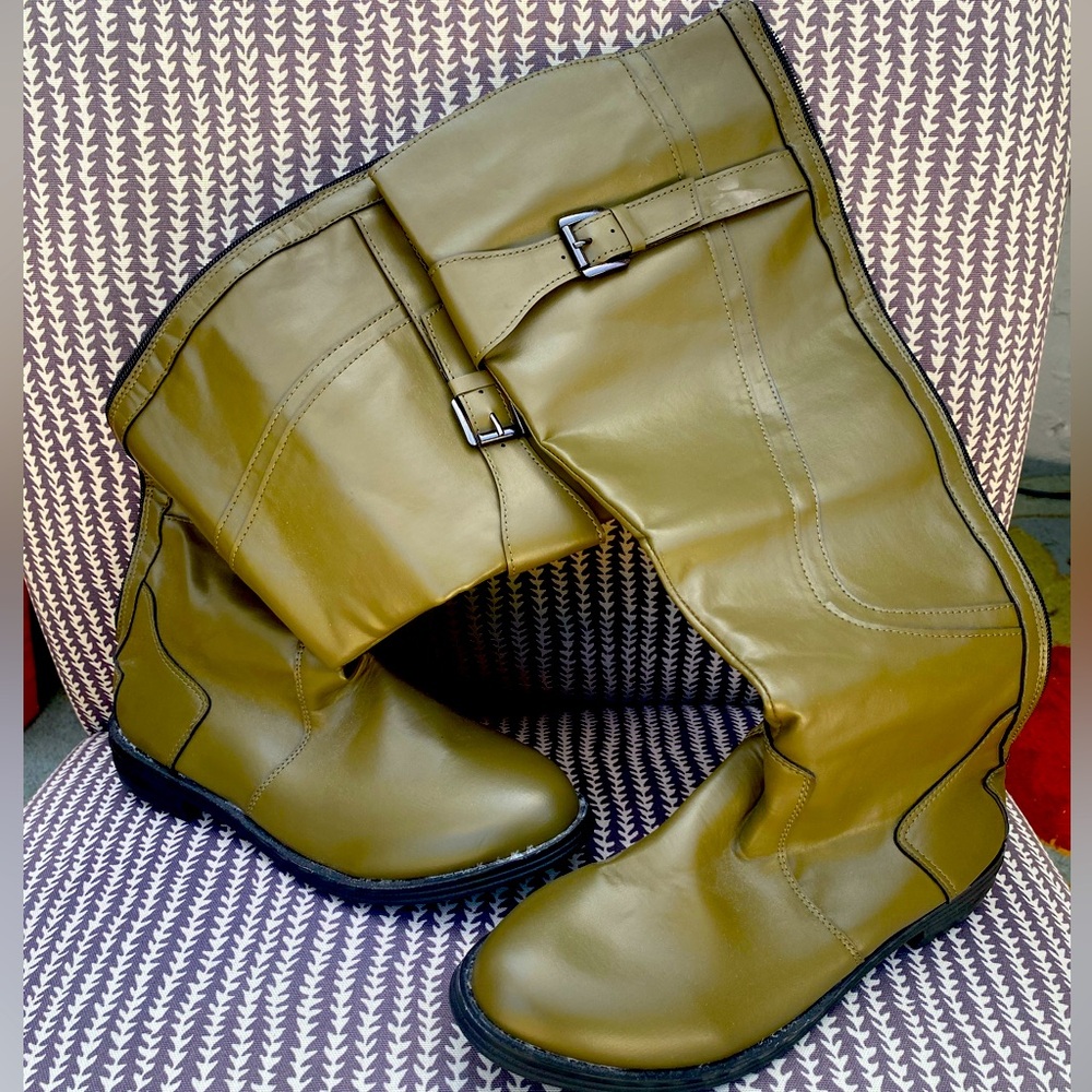 Olive green knee high, faux leather boots. Zips up the back. Low heel.